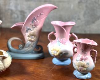 This lot features seven pieces of antique Hull pottery in very good condition. The tallest piece measures 8.5” H x 9” W x 3” D. Hull pottery began production in 1905 in Crooksville, Ohio, under the leadership of Addis Emmet (A.E.) Hull. The Hull Pottery Company’s early lines consisted of common utilitarian stoneware, semi-porcelain dinnerware and decorative tile.

