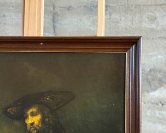 "Aristotle with a Bust of Homer", a professionally framed print by listed artist, Rembrandt van Rijn from the Museum of Modern Art with original label on the verso as seen in photos. This piece measures in frame, 32” H x 30.75” W. Rembrandt Harmenszoon van Rijn, born in Leiden, Netherlands, on July 15, 1606, was a prolific Dutch painter and printmaker of the Dutch Golden Age. He is widely regarded as one of the greatest visual artists in history. His career is marked by his innovative use of light and shadow, his mastery of portraiture, and his dramatic depictions of biblical and mythological scenes. 
