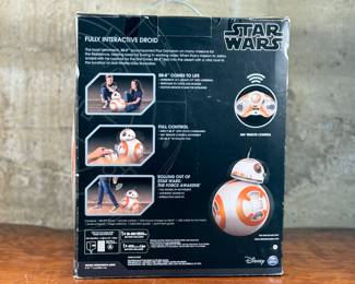 This lot features a new in box, Star Wars Hero Droid BB-8 fully interactive droid. Hero Droid BB-8 comes to life with an impressive height of over 16 inches (19 inches with antenna), voice and sound responses, and a motion sensor. Enjoy full control of your BB-8 with multiple voice commands, 360-degree remote control movement, and unique Follow Me mode which allows Hero Droid BB-8 to roll along beside you just like in the film!
