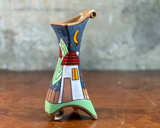 This lot features a stunning handmade flower pottery vase by Gappa in the town of Goole in the UK. Measures, 9” H x 4” W x 3.5” D. Maker mark present underneath as shown in photos.
