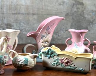 This lot features seven pieces of antique Hull pottery in very good condition. The tallest piece measures 8.5” H x 9” W x 3” D. Hull pottery began production in 1905 in Crooksville, Ohio, under the leadership of Addis Emmet (A.E.) Hull. The Hull Pottery Company’s early lines consisted of common utilitarian stoneware, semi-porcelain dinnerware and decorative tile.
