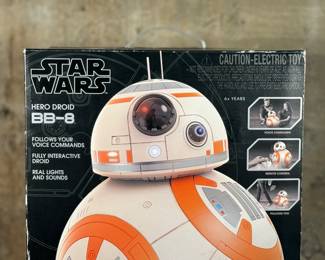 This lot features a new in box, Star Wars Hero Droid BB-8 fully interactive droid. Hero Droid BB-8 comes to life with an impressive height of over 16 inches (19 inches with antenna), voice and sound responses, and a motion sensor. Enjoy full control of your BB-8 with multiple voice commands, 360-degree remote control movement, and unique Follow Me mode which allows Hero Droid BB-8 to roll along beside you just like in the film!
