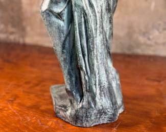 This lot features a famous replica of the Venus de Milo, one of the most famous ancient Greek sculptures. Made in Spain with maker mark near bottom as shown in photos. This sculpture is believed to be made of a hollowed bronze and measures, 24” H x 7.5” W x 7.5” D. The Venus de Milo is a masterpiece of Hellenistic sculpture and is renowned for its idealized beauty and enigmatic appeal, partly due to its missing arms.
