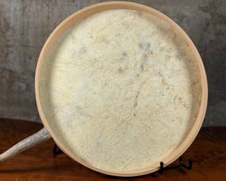 “Tlingit Eagle”, artwork on a drum by listed artist Jerry Lieb, Jr., otherwise known as Sivaluaq circa 2006. This work comes with a mounted handle and measures, 21.75” H x 15” W. Artist and artwork information on the verso as shown in photos.
