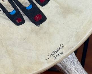 “Tlingit Eagle”, artwork on a drum by listed artist Jerry Lieb, Jr., otherwise known as Sivaluaq circa 2006. This work comes with a mounted handle and measures, 21.75” H x 15” W. Artist and artwork information on the verso as shown in photos.
