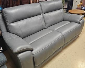 $425 Pre Sale Item - See Sale Description for purchase details. Blue leather sofa, electronic controls for reclining and fot rest. Excellent condition! 80.5"w x 33.5"d x 40.5"h Pic 1 of 7
