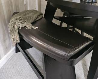 $495 Pre Sale Item - See Sale Description for purchase details. Bar Height Dining Table Set, Color Black. Triangular Table, seats 4 . Includes table, 2 leather chairs and leather bench, Seating: 32"H. Table 54"L x 54"W x 41"H. Pic 4 of 4