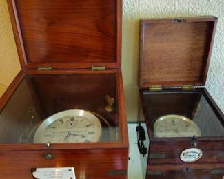 Two antique ship's clocks from England and Scotland in fitted wood boxes