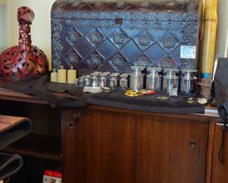 Weight collection and interesting chest. A bamboo rain stick is shown at right.