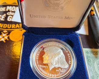 Special Olympics 1 oz silver coin in all boxes and sleeve.