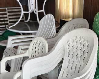 Two Round Glass Topped Patio Tables & Multiple Plastic Patio Chairs; including Two Patio Table Umbrellas