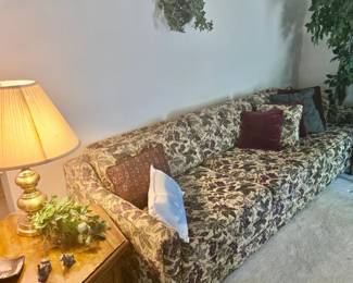 Vintage Sofa (long); Silk Plants; Hexagon End Table; Brass Lamp