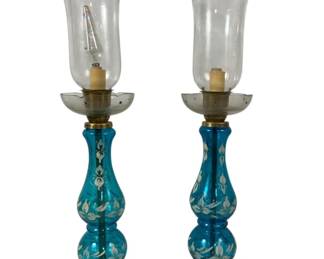 1118 - Matching Pair Hurricane Lamps, Blue Glass 25" Tall You are buying a used as-is electric/electronic item. We do not guarantee all components are present, and if it is not expressly stated, it is untested.