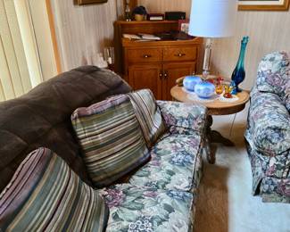 Floral Upholstered Love Seat; Oak End Table; Lamps; Wall Decor; MCM Glass Vase and Crackle Glass Pitchers; an Oak Dry Sink