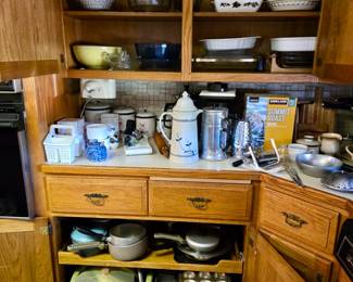 This kitchen is chock full of baking pans; Carafes; Coffe Makers; Mixing Bowls, Pie Pans and much much more!