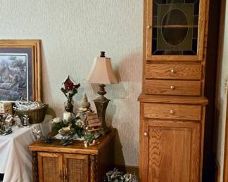 Tall Oak Cabinet with Leaded Glass Door, Drawers and Lower Cabinet -- Great for Storage; Wood and Rattan Side Table; Table Lamp; Christmas Decor and more!