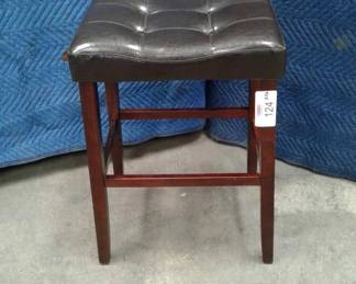 Two tuffed stools, brown color, leather like, wood frame with footrest