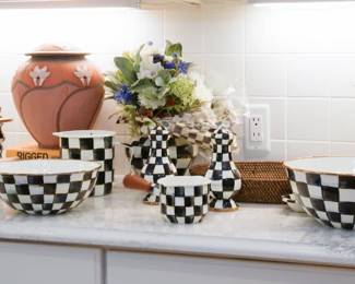 Numerous pieces of MacKenzie-Childs hand-painted dishware, ceramics, and other decor are available.