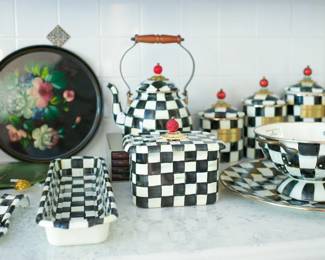 Numerous pieces of MacKenzie-Childs hand-painted dishware, ceramics, and other decor are available.