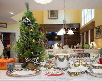 Numerous pieces of MacKenzie-Childs hand-painted dishware, ceramics, and other decor are available.