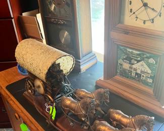 covered wagon with 4 horses clock