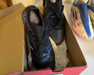 A lot of expensive cleats for soccer