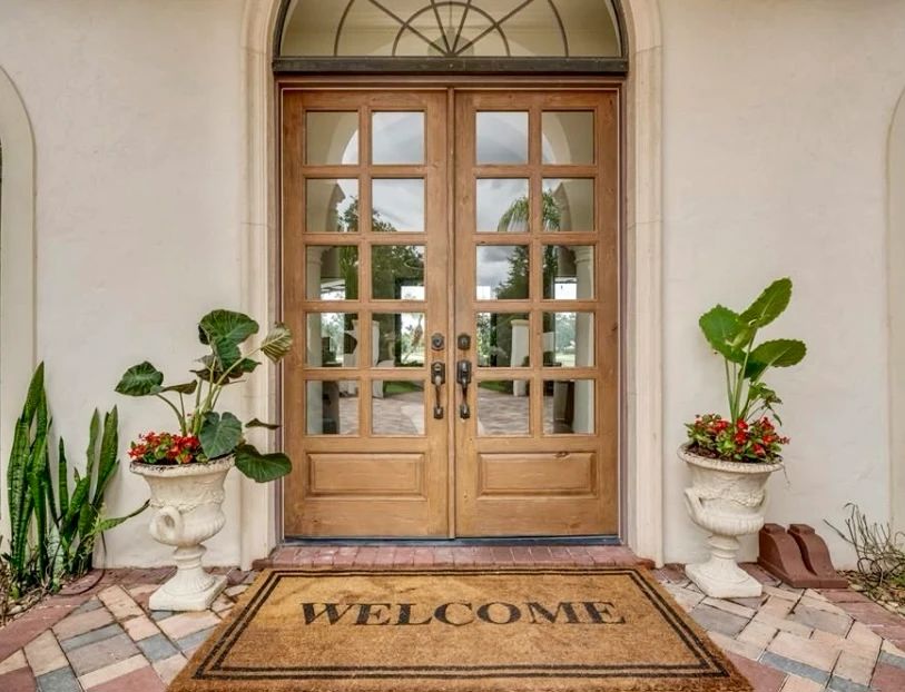 Welcome mat and stone cast planters