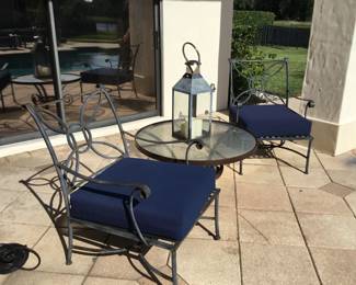 Iron chairs, table and lantern