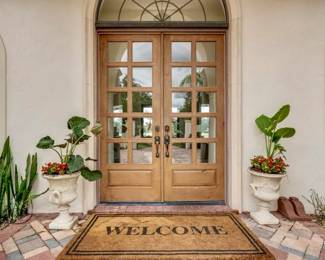 Welcome mat and stone cast planters