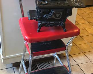 Red Cosco step stool + Crescent cast iron toy stove with pans & coal bucket