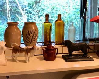 Crocks, Fitz & Floyd cow butter dish, cow creamer, old brown bottles, cast iron dog nutcracker