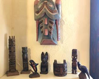 Unsigned NW native carvings including totem poles, New Zealand tiki