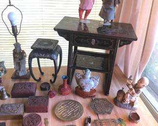More Asian: plant stand with mother of pearl inlay, lacquer table with drawer, brass trivets, carved stone vase on stand