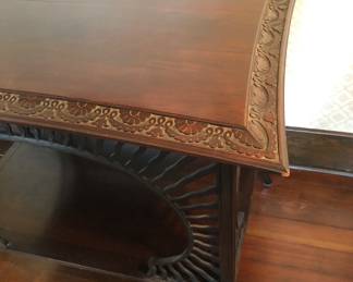 Carving on table edge - note curved edges