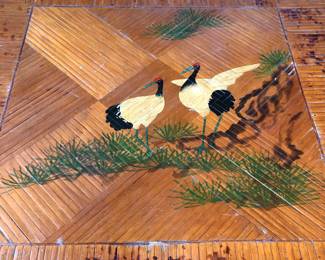 Painted birds on table top