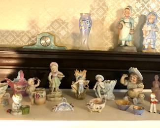 Bisque figurines, green celluloid clock, salt & pepper shakers 