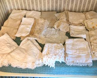 Lots of old linens: embroidered tablecloths, crocheted runners & doilies 