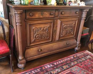 Antique oak buffet with carved doors (as shown: 60”L, 26”D, 42.5”H) - with mirror backsplash