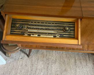 A look at the radio on the mid century cabinet $300