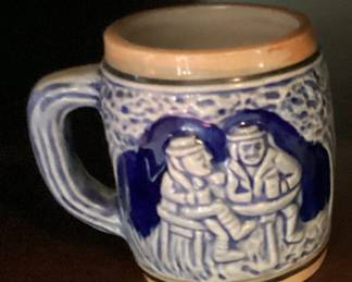 Vintage minature beer stein Couple on a bench