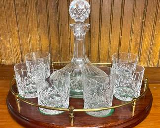 Waterford decanter, crystal glasses on wood serving tray