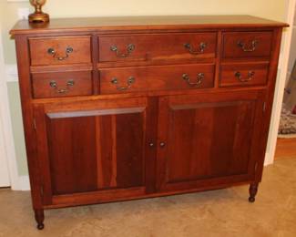 Gat Creek Holiday Buffet - seasoned cherry with burnished knobs and pulls. Deep drawers on side, single drawers middle, and a storage shelf inside bottom, 55" w x 45" h x 17" d
