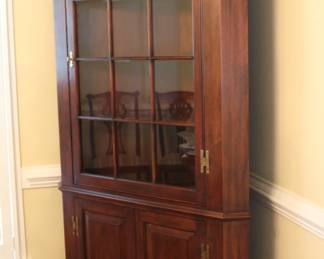 Corner cabinet with glass doors and lighting