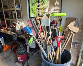 Selection of garden tools, garage supplies and regular tools
