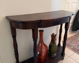 Half moon wooden accent table with spindle legs