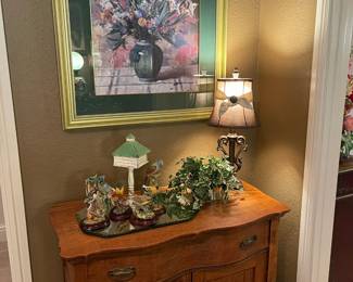 A closer look at the antique chest and art work, collection of bird figurines