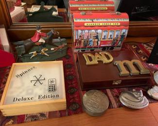 Games, brass paper weights, vintage lunch box, door stop