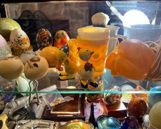 Vintage toys, collection of eggs, vintage baby cups and night light, toy gun, vintage lighers, buckles
