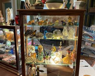 This showcase contains, mini shoes, perfume bottles, vintage movie camera, and lots more!