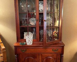 This piece is in the dinning room and contains, vintage stem ware, china and glass pieces